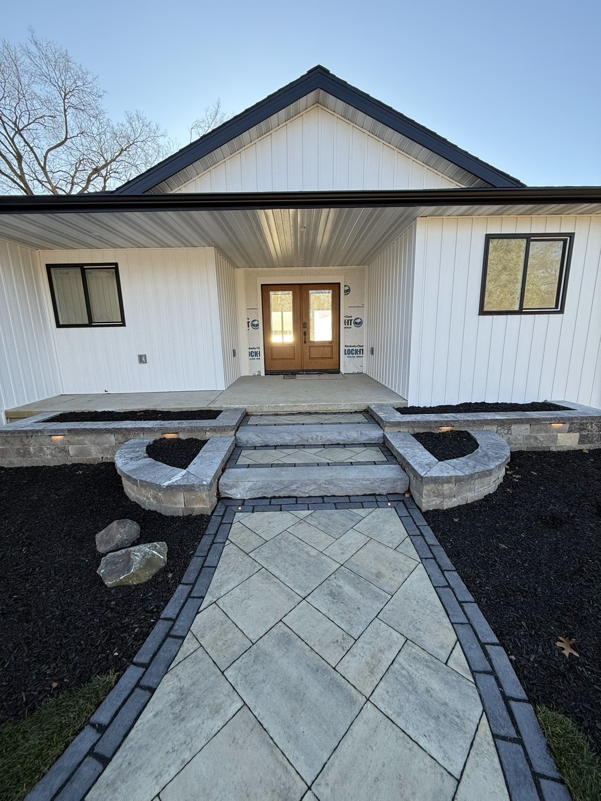 Lakeside patio layout and perimeter retaining wall installation view 1
