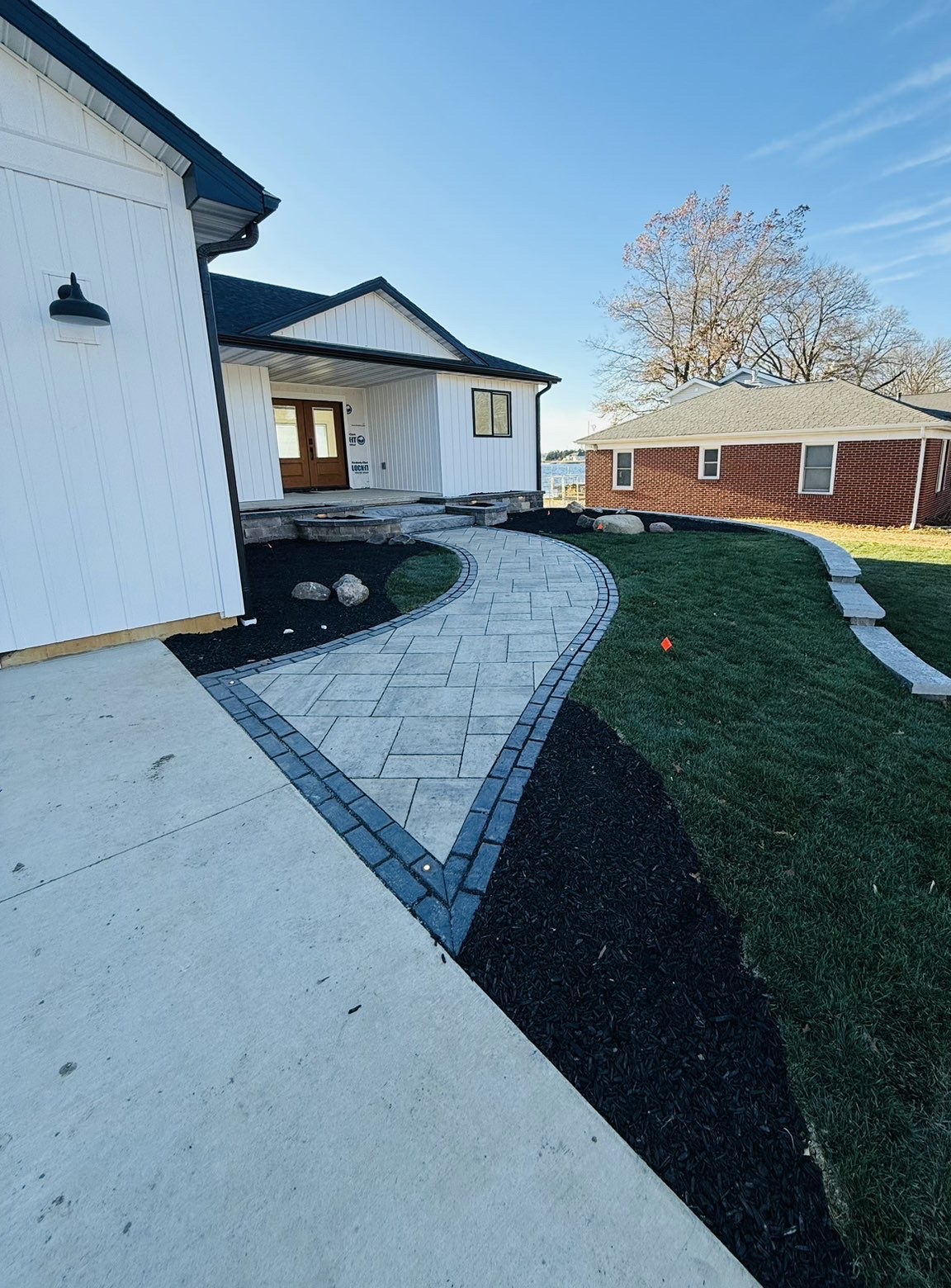 Lakeside patio layout and perimeter retaining wall installation view 2