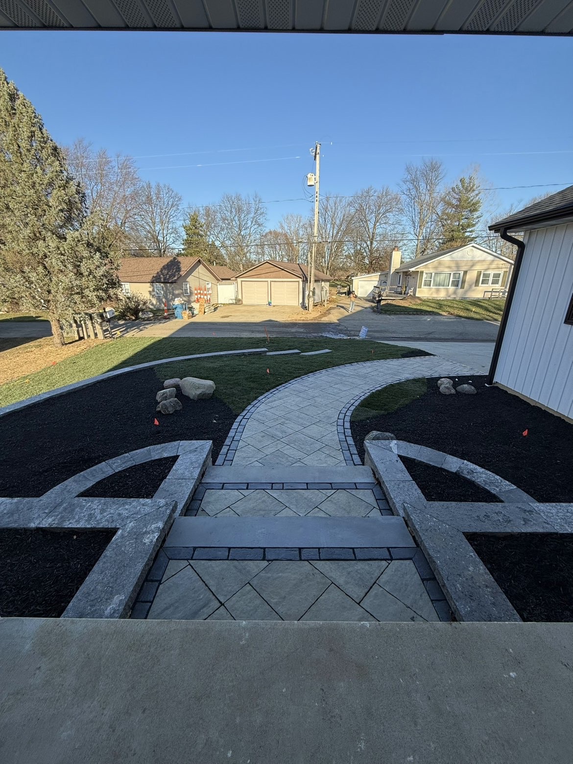 Lakeside patio layout and perimeter retaining wall installation view 4