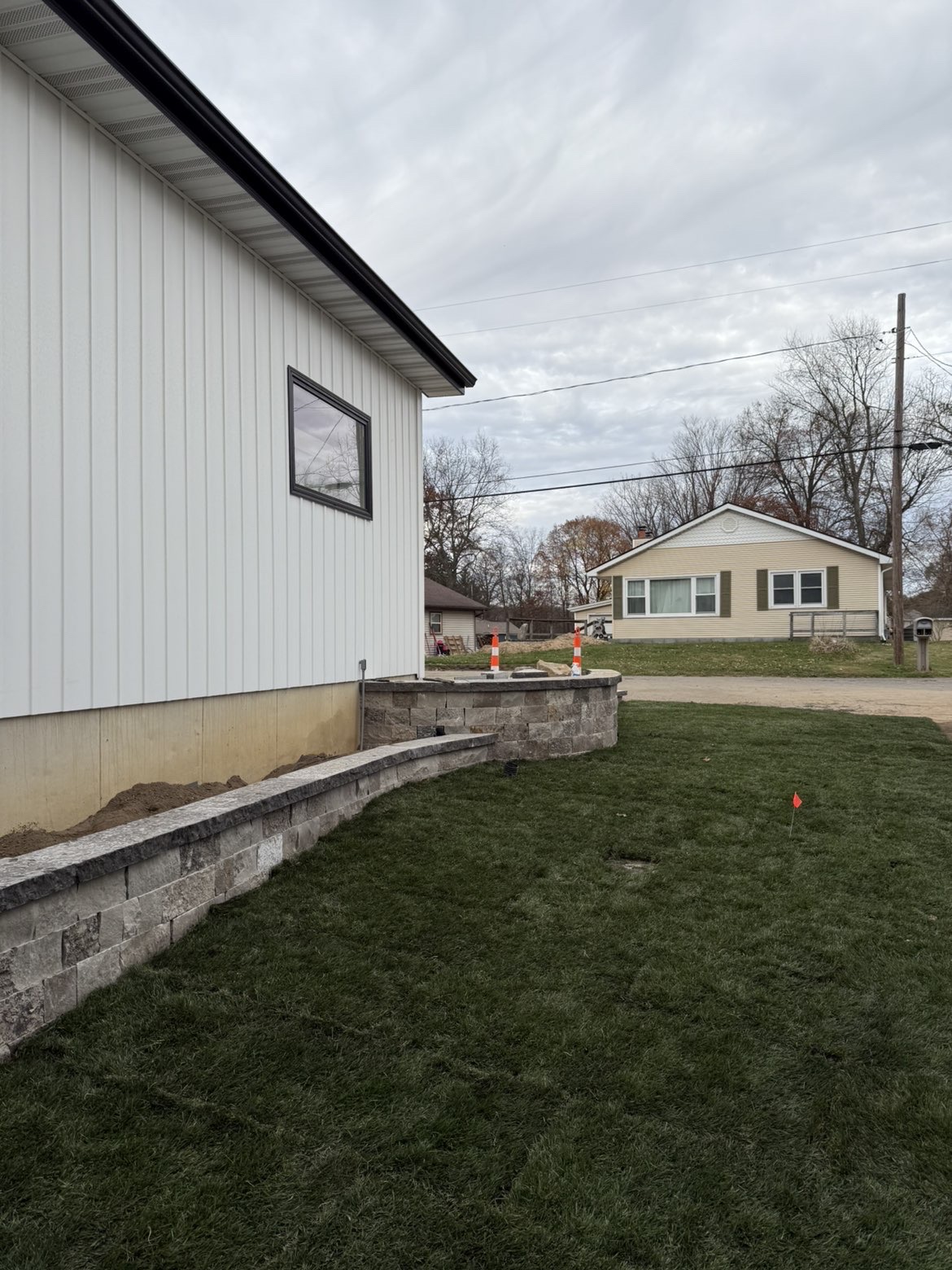 Lakeside patio layout and perimeter retaining wall installation view 5