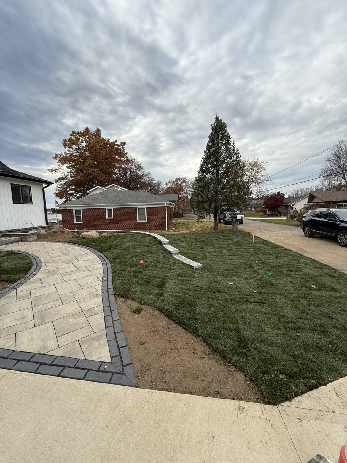 Lakeside patio layout and perimeter retaining wall installation view 6