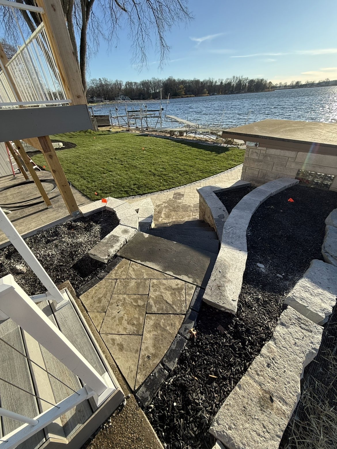 Lakeside patio layout and perimeter retaining wall installation view 8