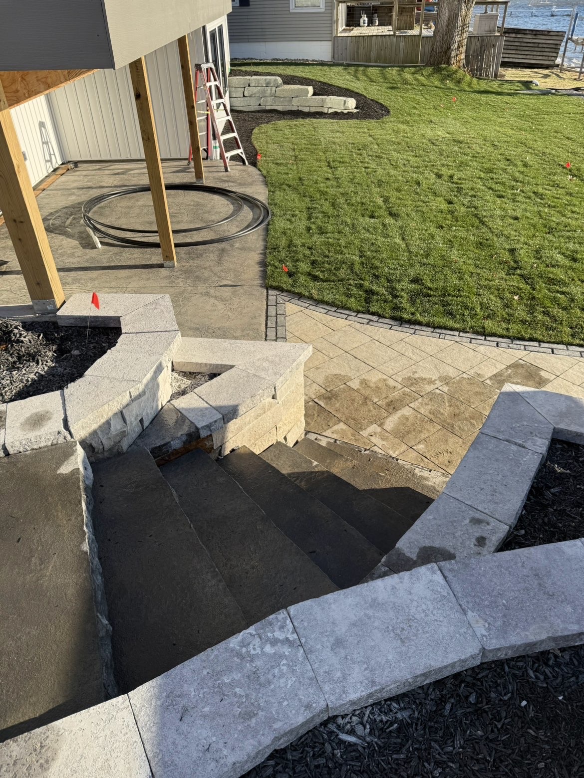 Lakeside patio layout and perimeter retaining wall installation view 9