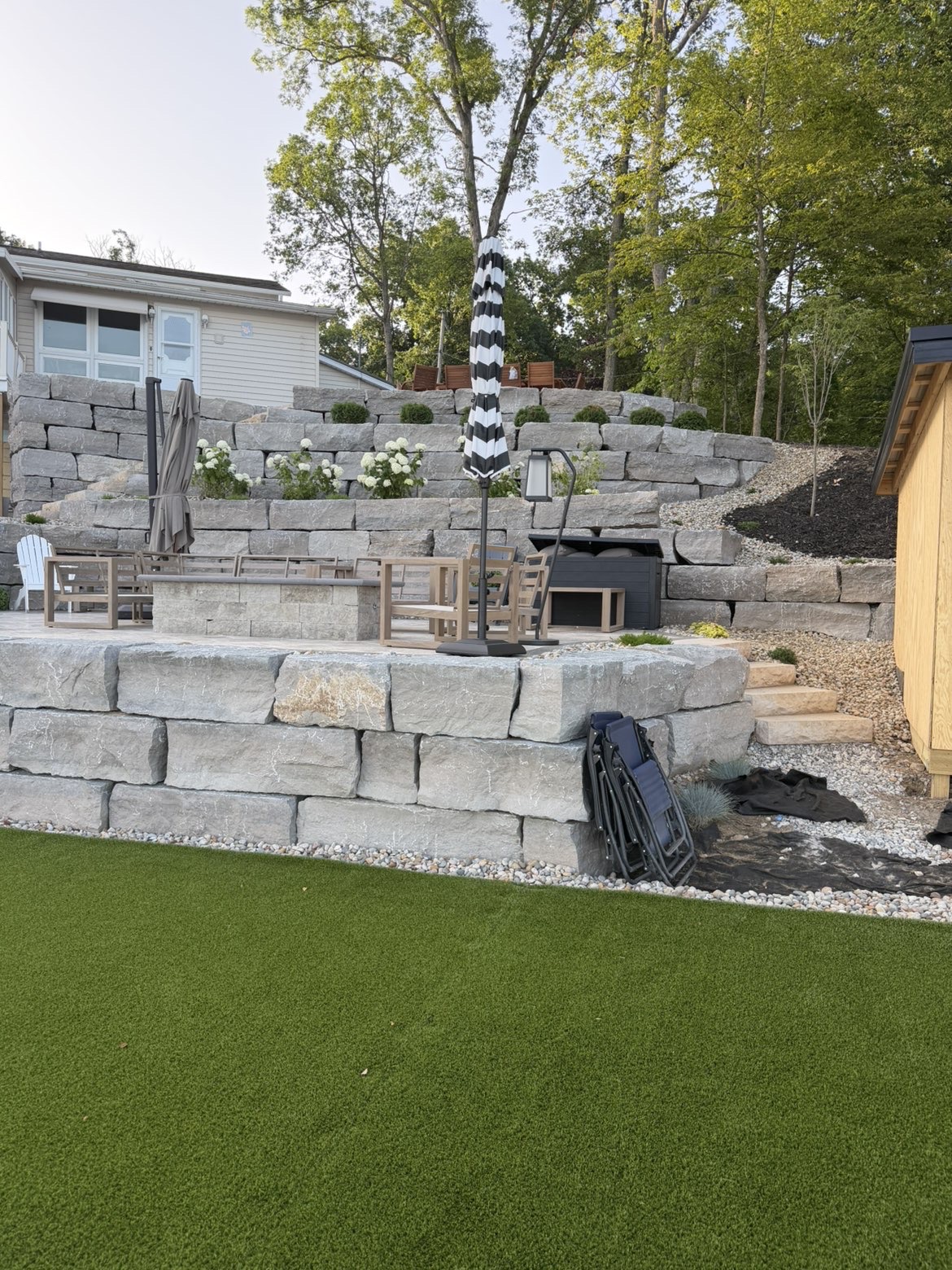 Finished lakeside stone patio area for entertainment