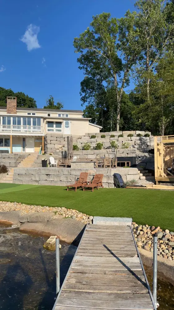 Complete transformation showcase of Duck Lake retaining wall and patio in Albion, MI
