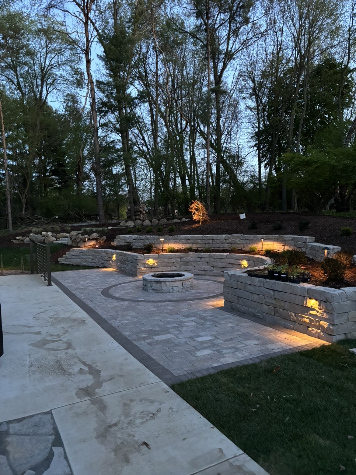 Close-up of integrated stone fire pit construction and masonry craftsmanship