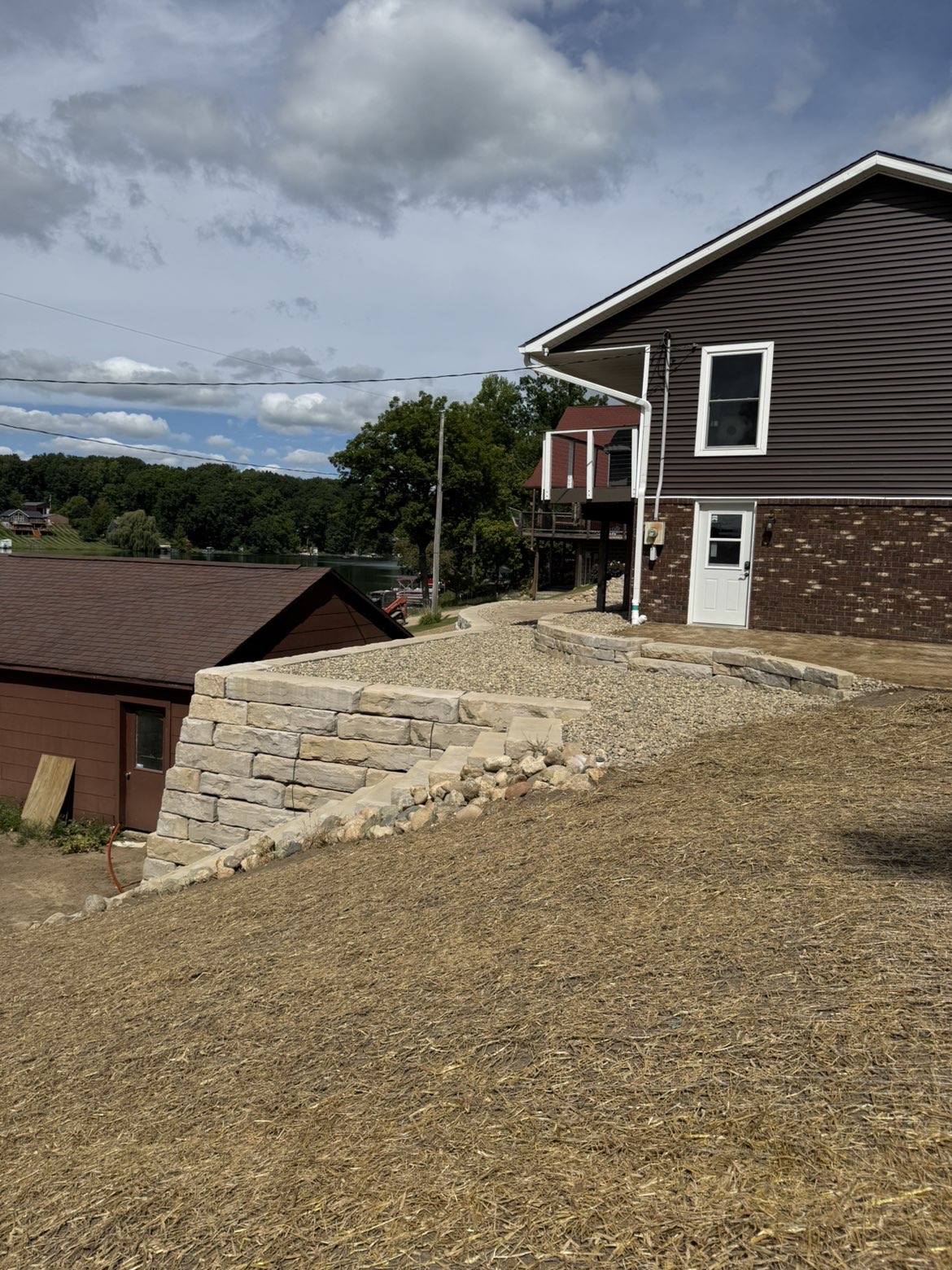 Wall capping stone installation on top level of retaining structure