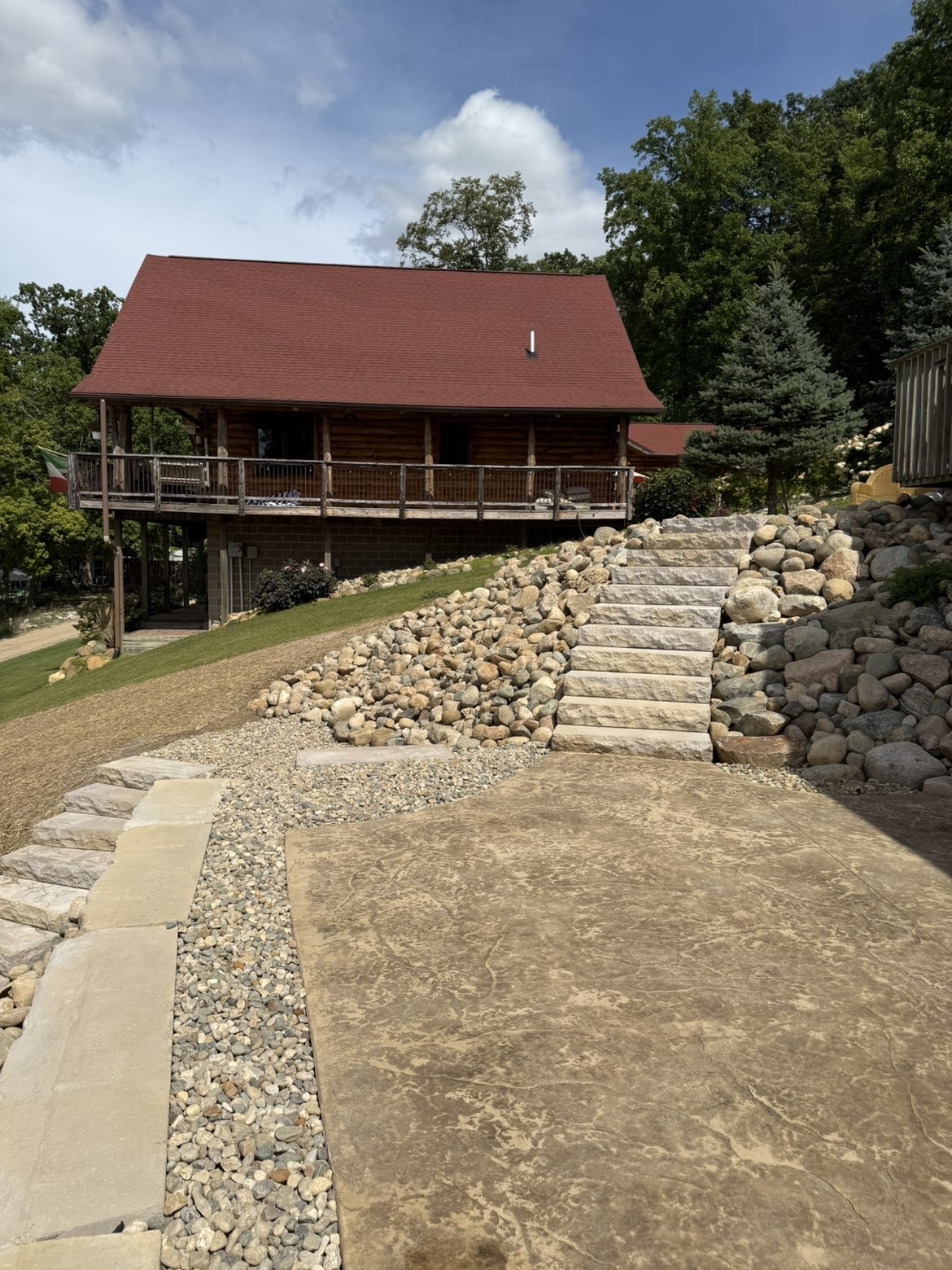 Finished paver walkway connecting to rear entertaining patio