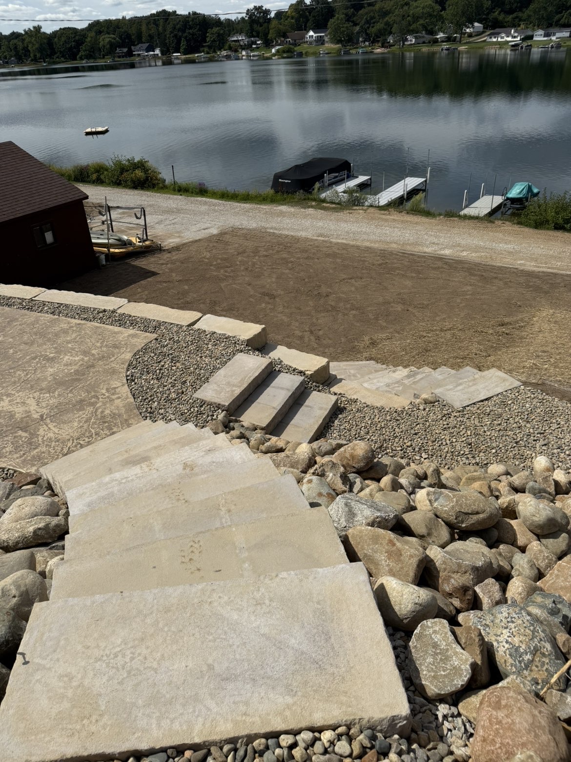 Complete transformation overview of hillside retaining walls and patio area