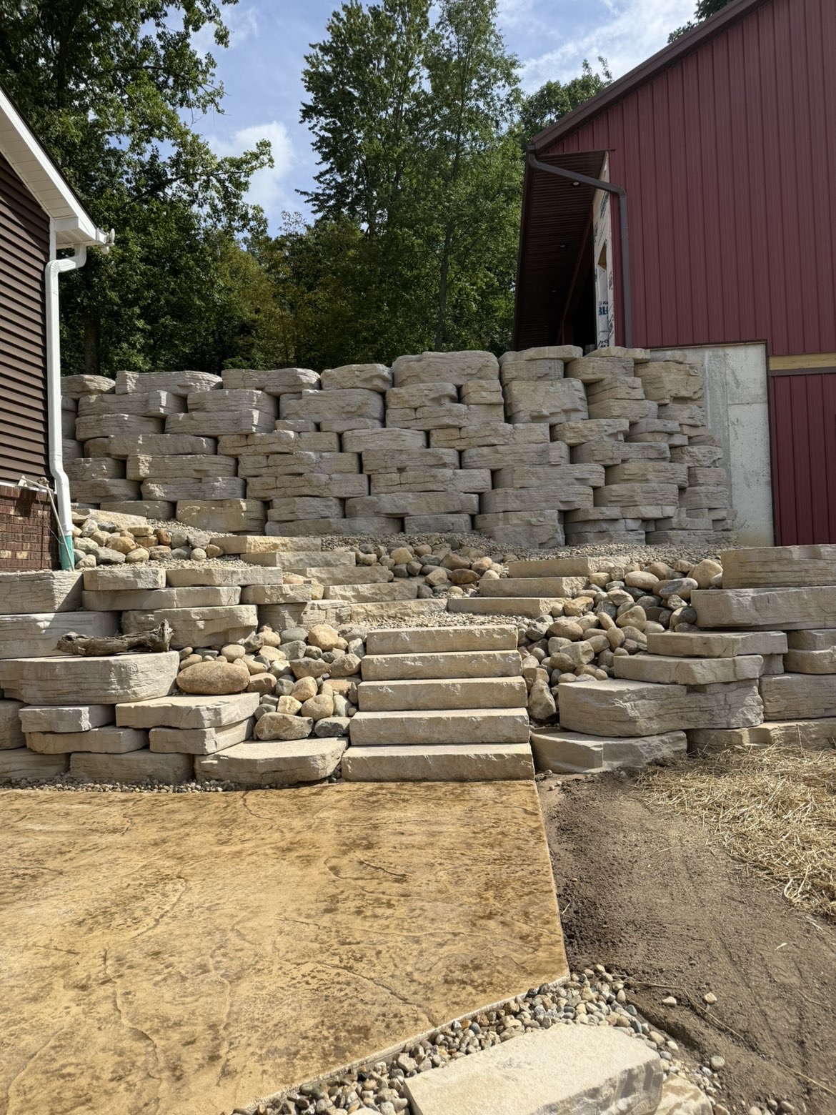 Side elevation view of multi-tiered retaining wall structural support