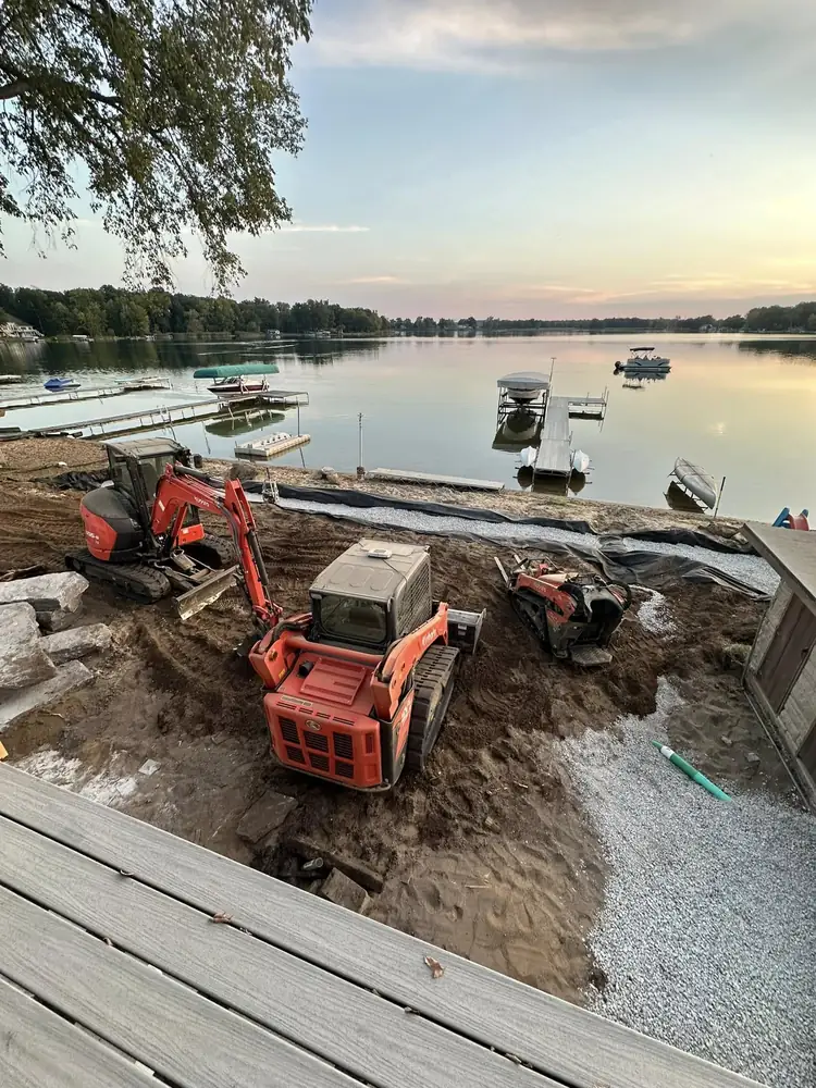 Precision land grading and site preparation using mini-excavator