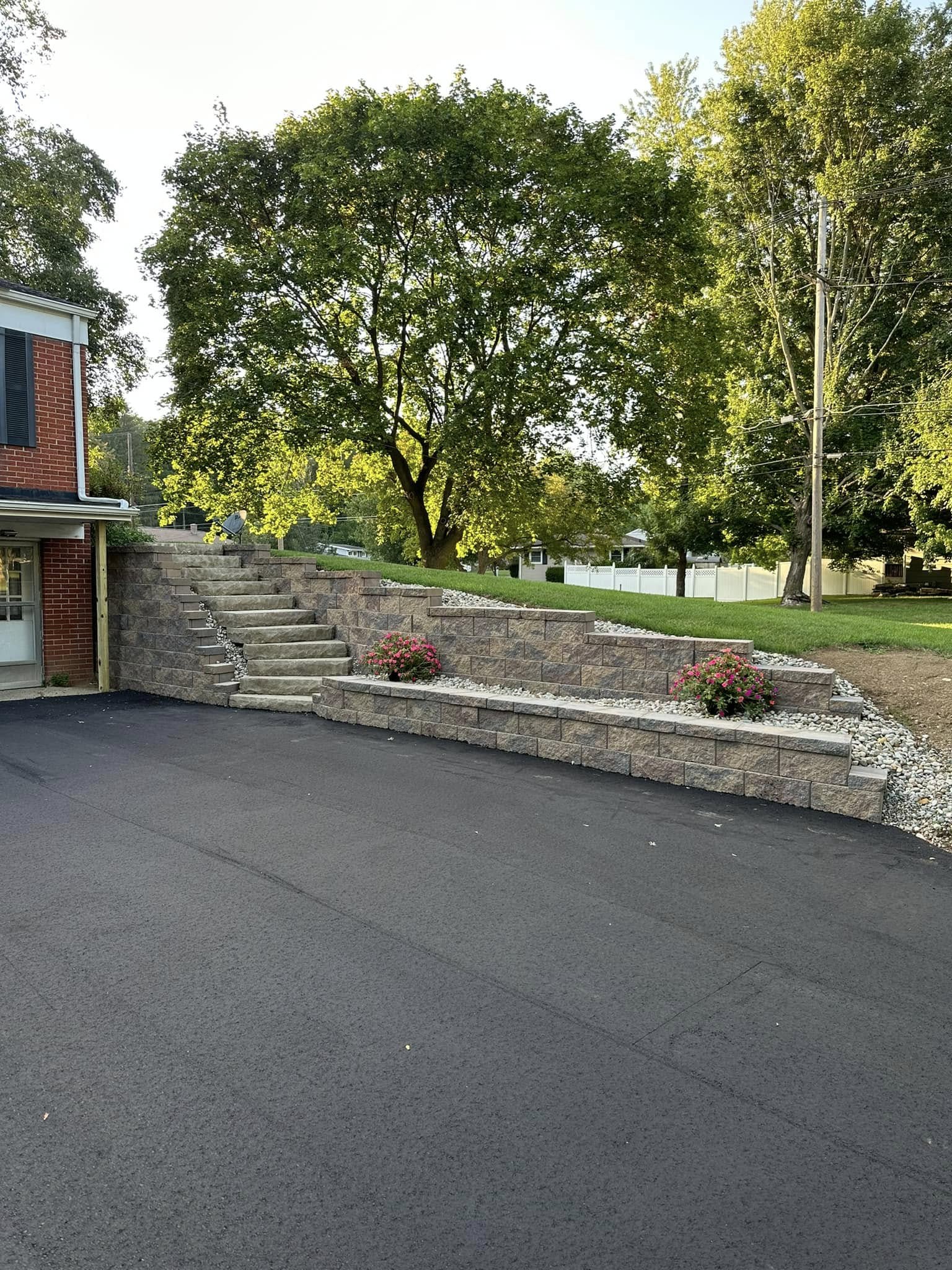 Heavy-duty block retaining wall build for grade control