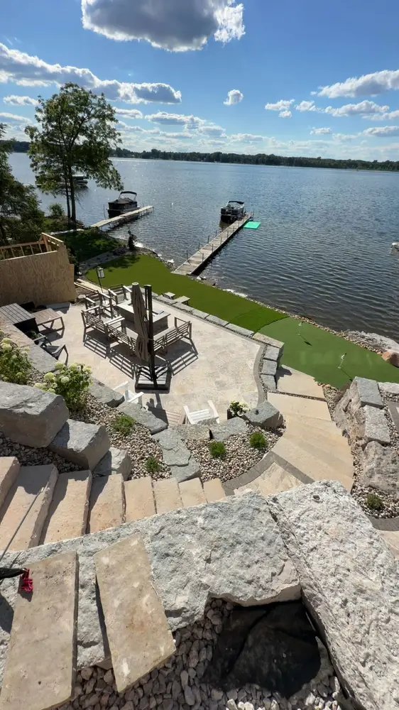Finished outdoor entertainment area with custom hardscaping details