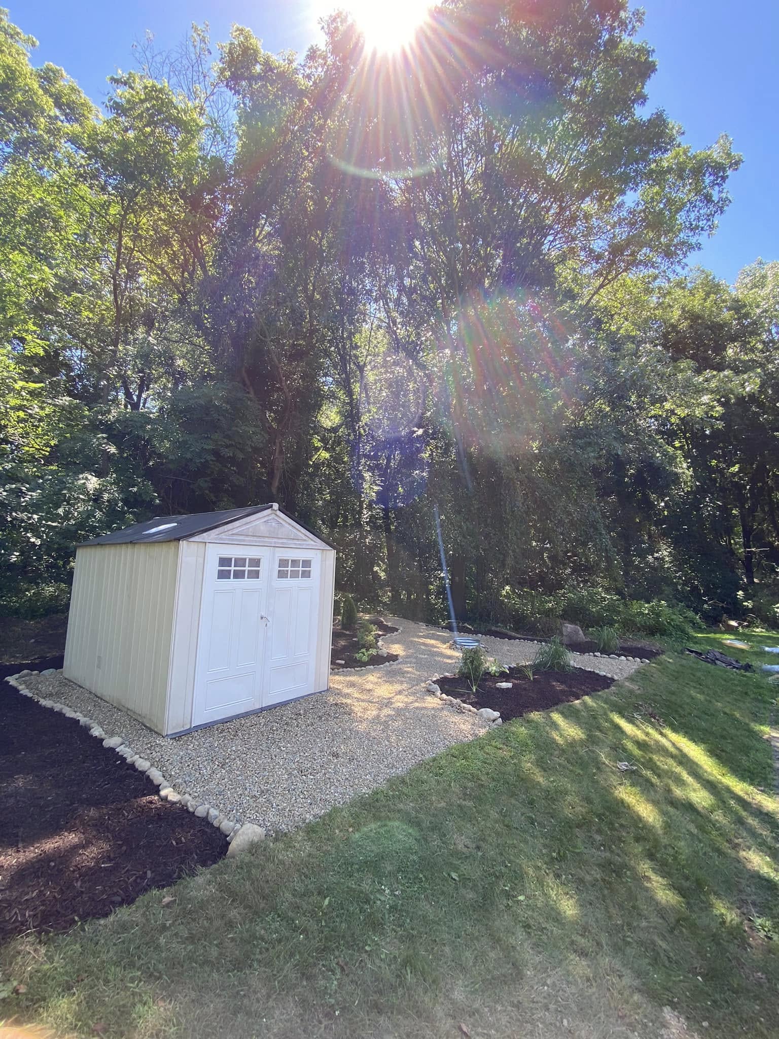 Decorative stone and fresh mulch installation project showcase