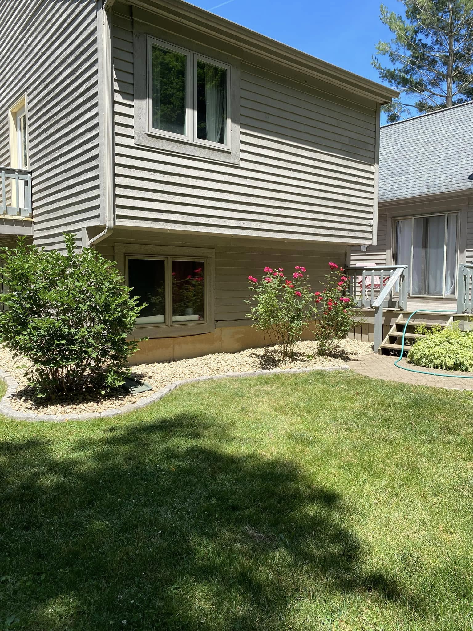 Custom paver walkway and integrated planting beds
